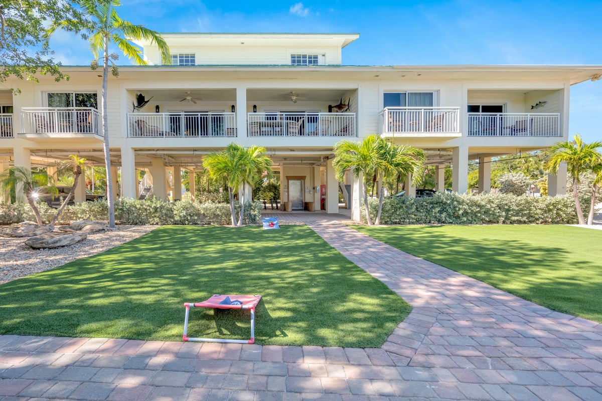 A cornhole set out on the lawn at Dove Creek Resort & Marina
